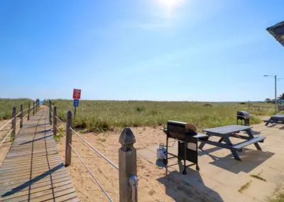 Picnic Tables, Grill and Adjacent Beach Boardwalk
